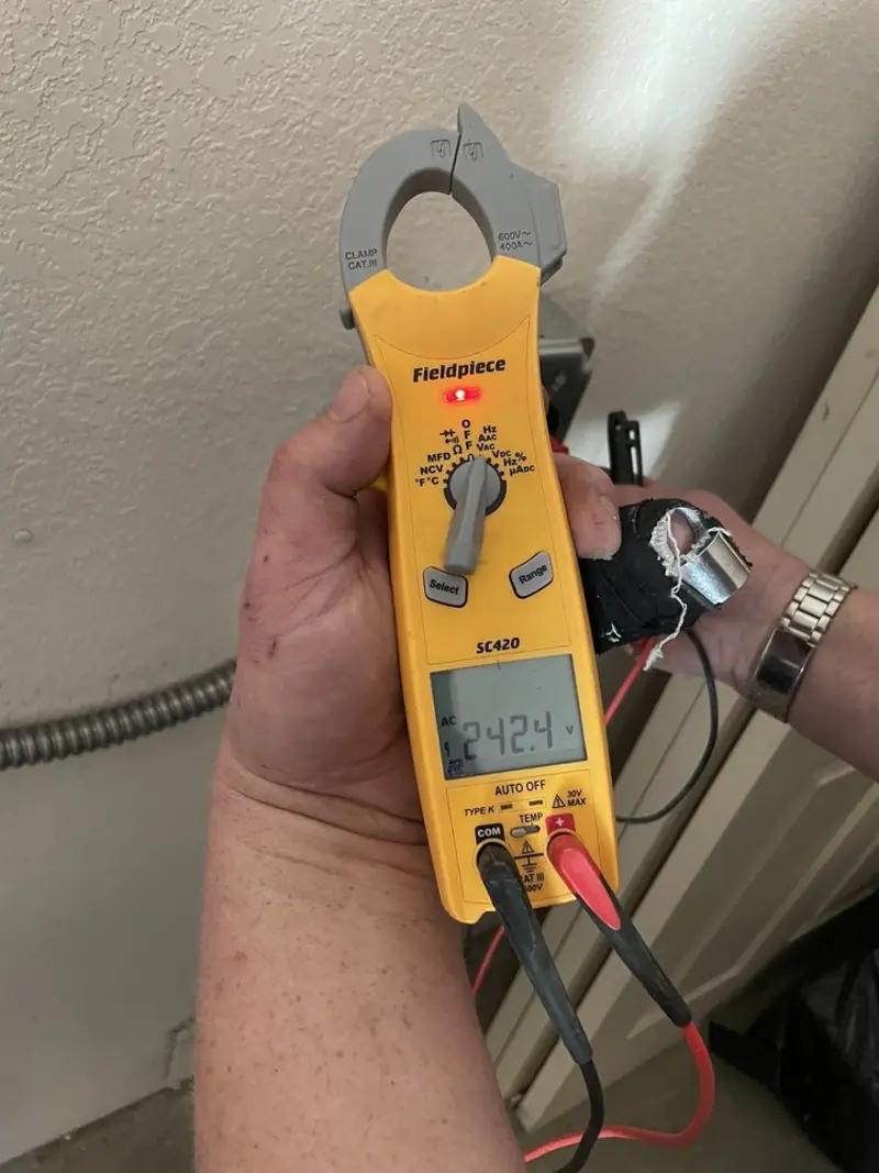 Voltage testing with clamp meter during Electrical Installation Services in Dunstable